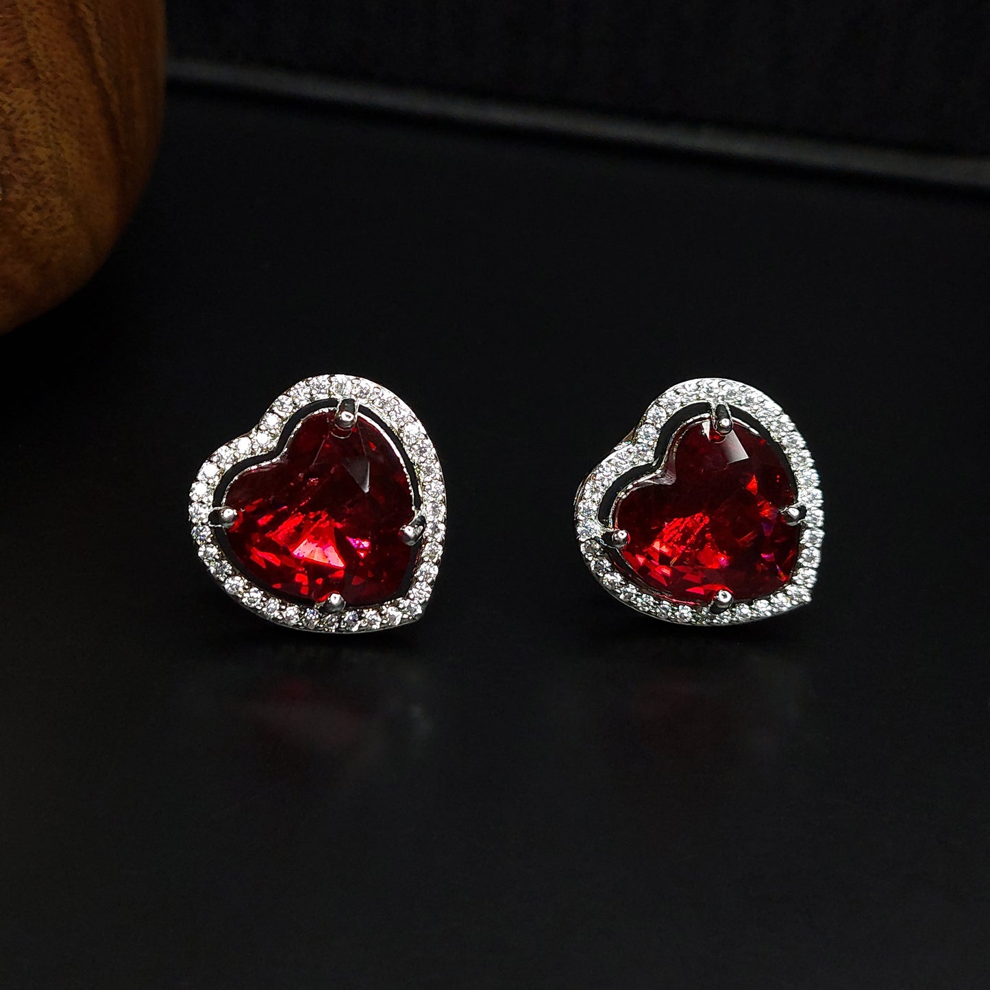 Ruby Red Rhodium Plated American Diamond Dazzling Heart Shaped Stud Earrings